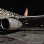 an airplane on the runway at night