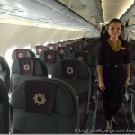 a woman standing in an airplane