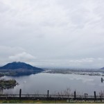 a body of water with a mountain in the background