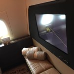a tv on a bench in a plane