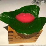 a pink lips shaped candy on a leaf