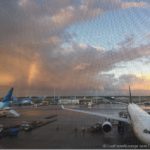 a group of airplanes at an airport