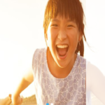 a girl laughing with her mouth open