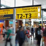 a group of people walking in a terminal