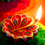 a lit candle in a flower shaped candle holder