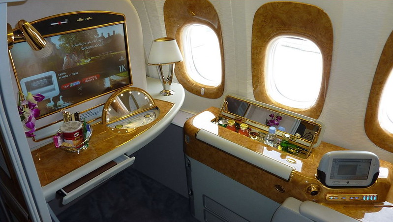 a tv and table in an airplane