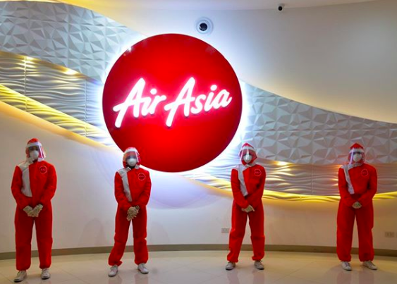 a group of people wearing red suits and masks