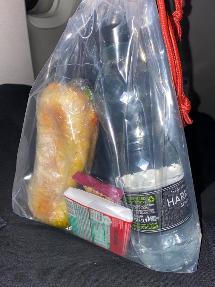 a bag of food and a bottle