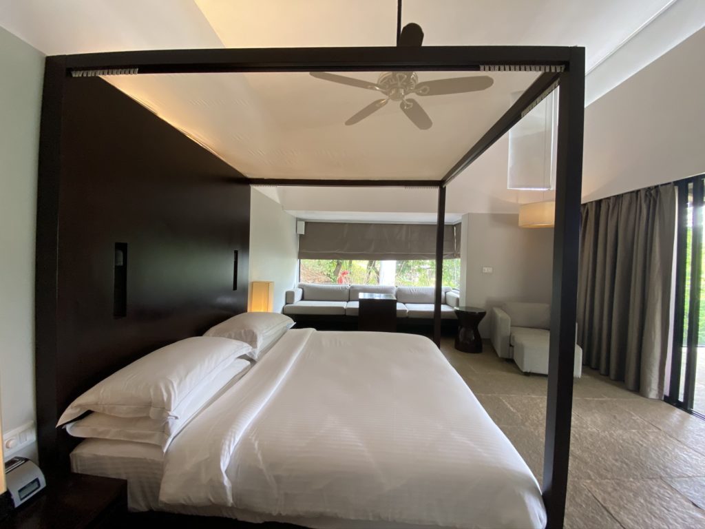 a bed with a glass canopy