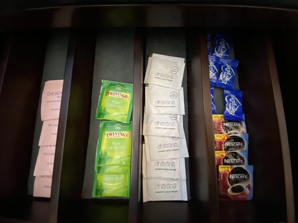 a drawer with tea packets and tea in it
