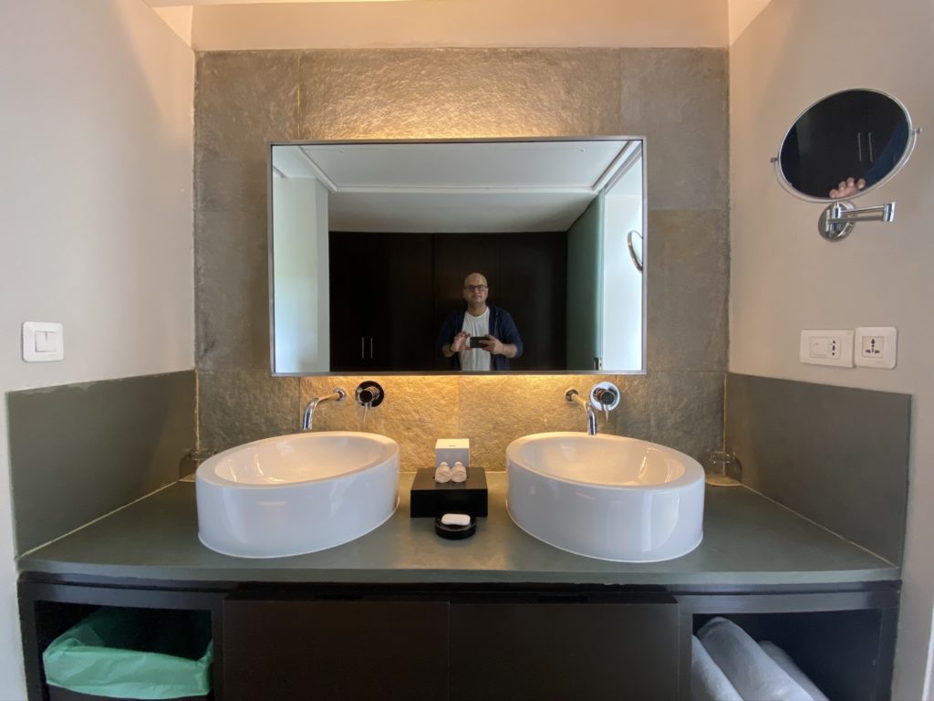 a man taking a selfie in a bathroom
