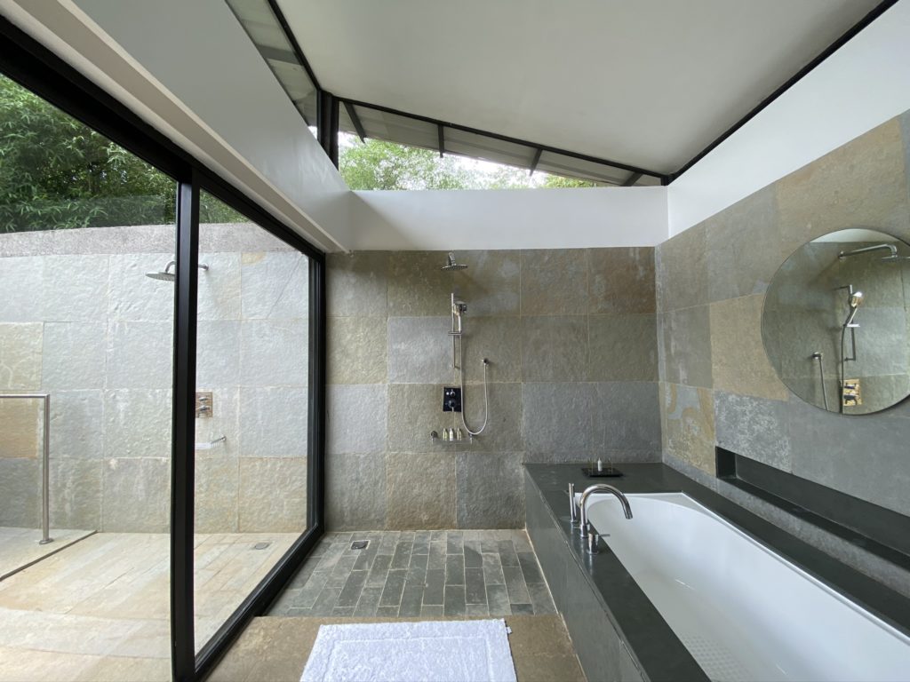 a bathroom with a tub and shower
