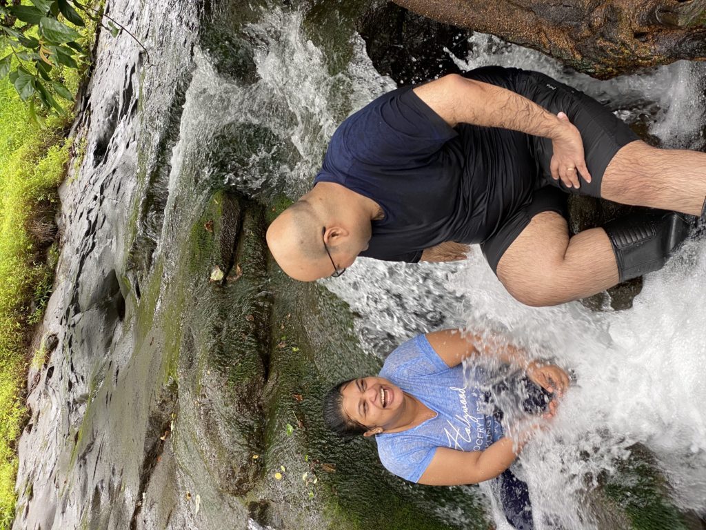 a man and woman sitting in water