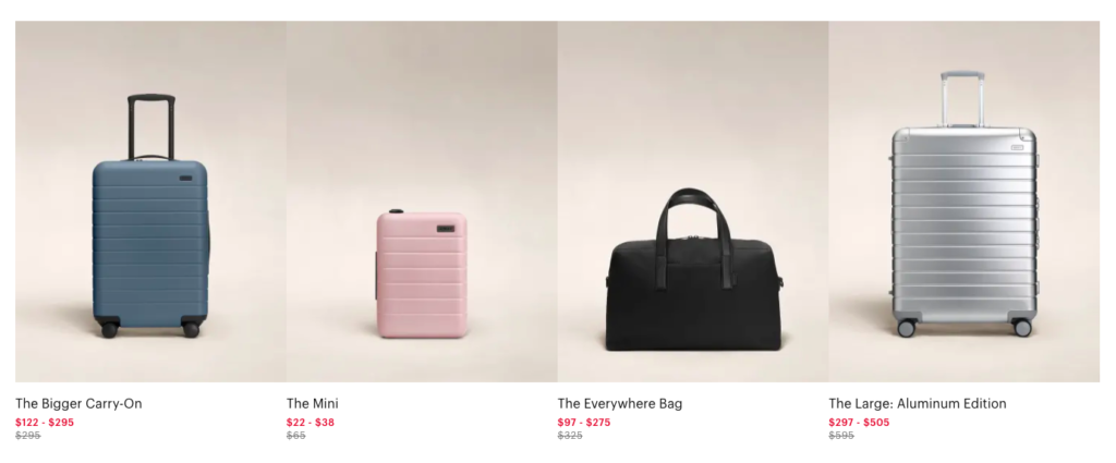 a black bag and pink suitcase