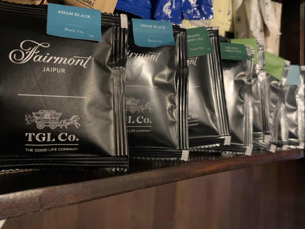 a group of black packets on a shelf
