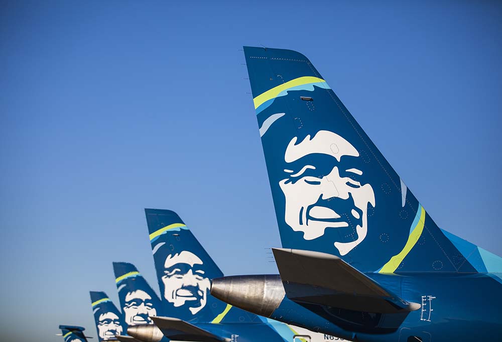 a group of airplanes with faces on the tail fin