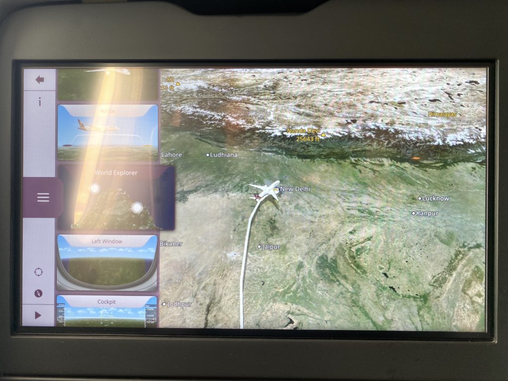 a screen with a map and a plane flying
