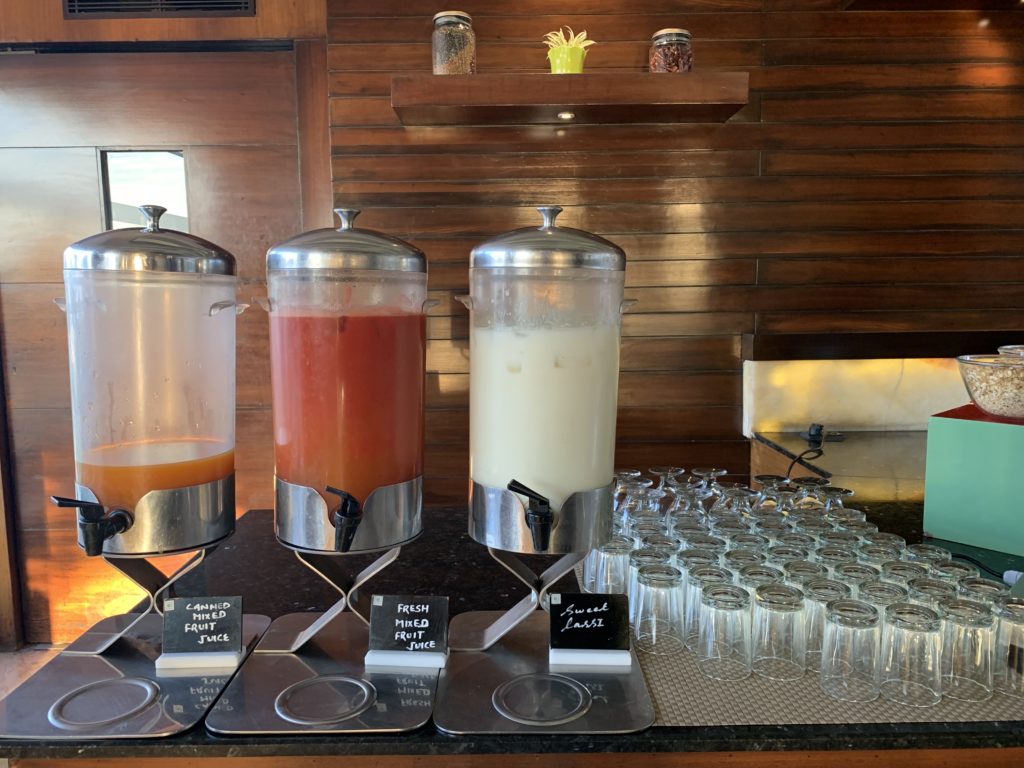 a row of drinks in containers