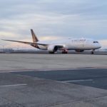 a white airplane on a runway