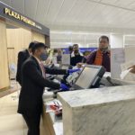 a group of people at a check-in counter