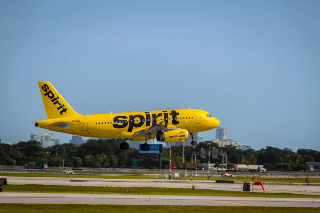a yellow airplane taking off