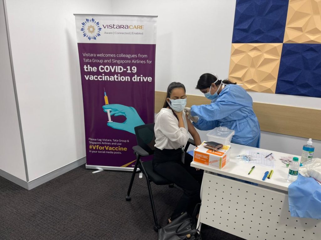 a woman getting a vaccine shot