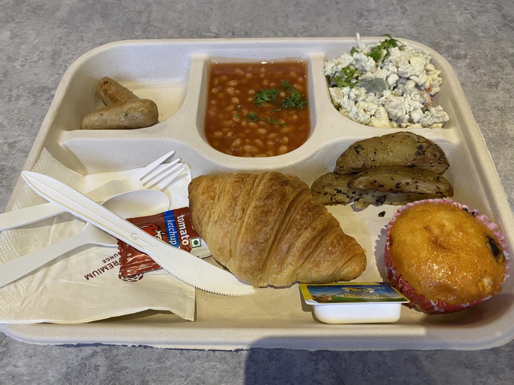 a tray of food with a couple of utensils