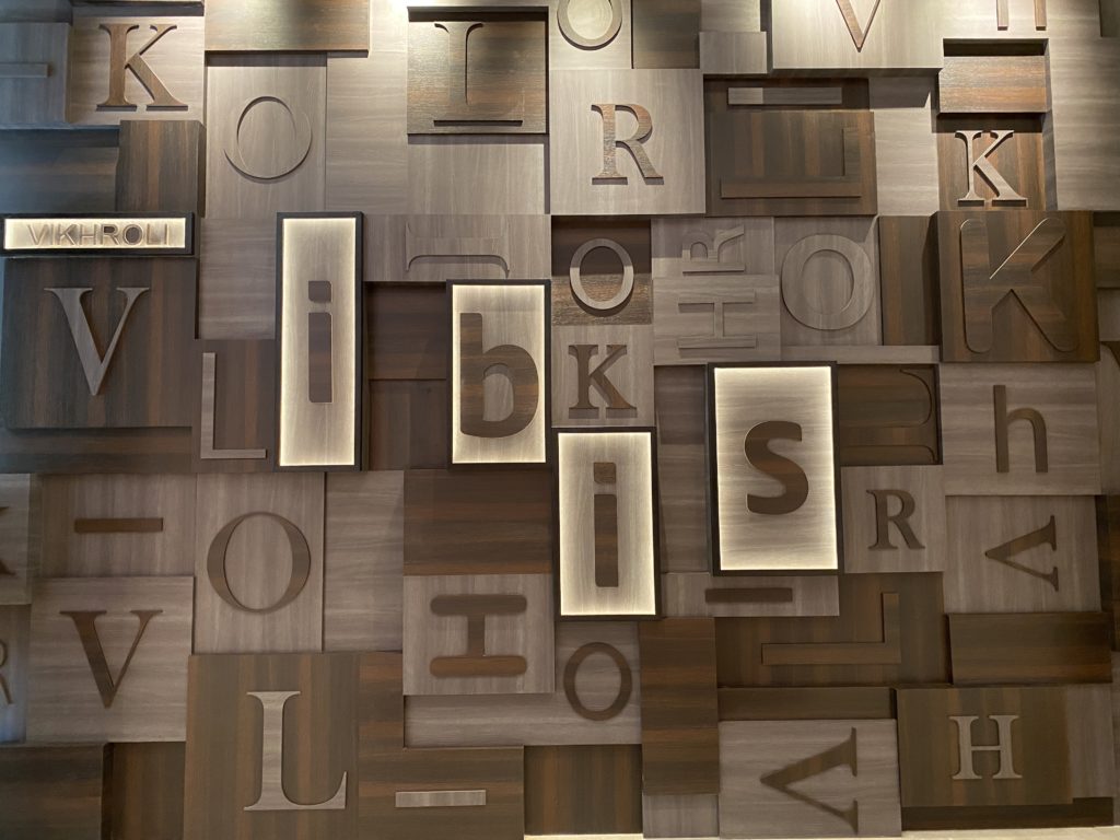 a wall with many letters