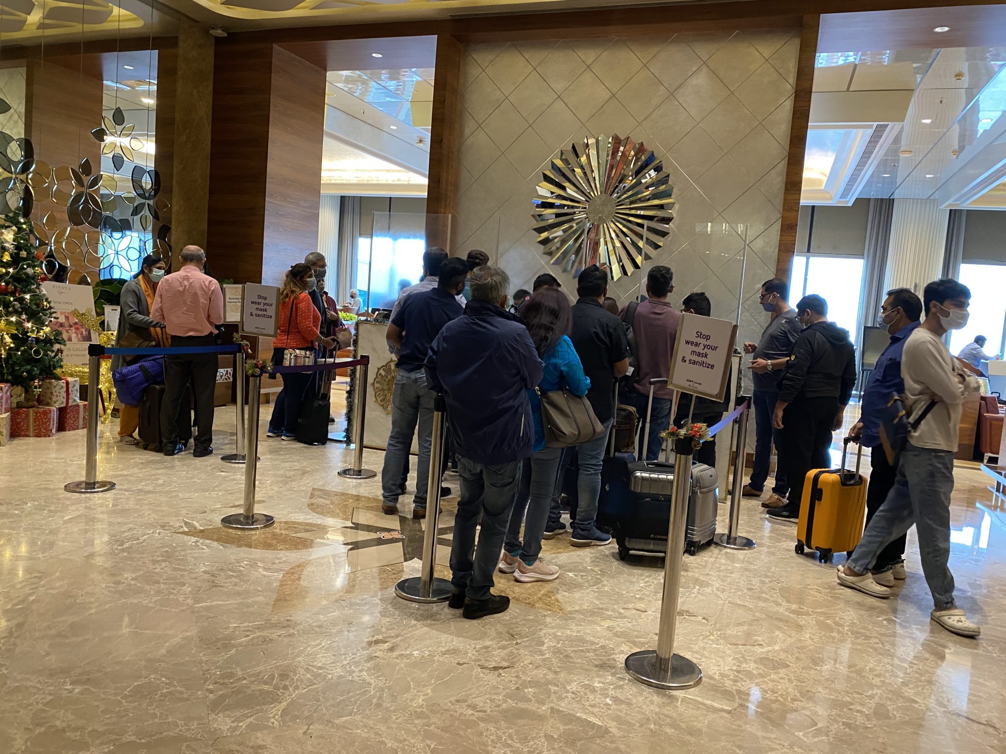 a group of people standing in a lobby