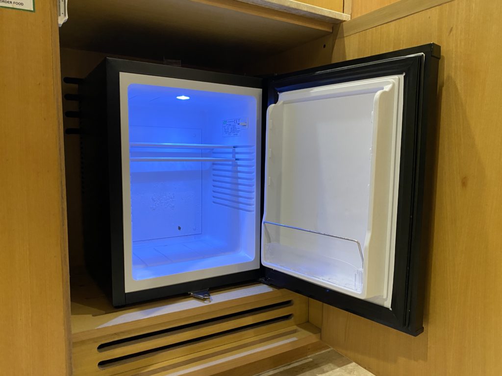 a small refrigerator with a light inside