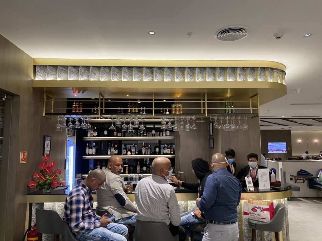 a group of people sitting at a bar