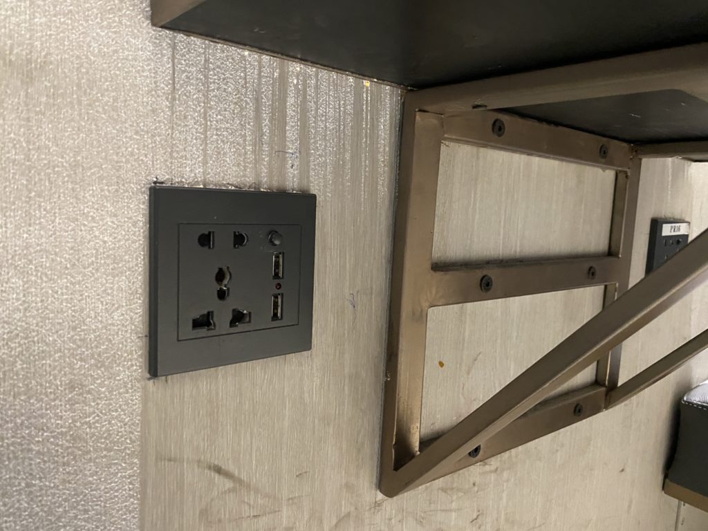 a wall outlet and a shelf