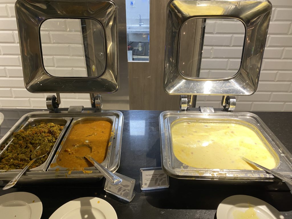 a buffet with food in containers