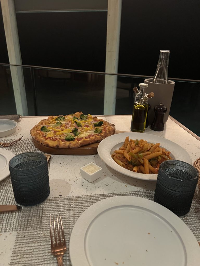 a table with plates of food and utensils