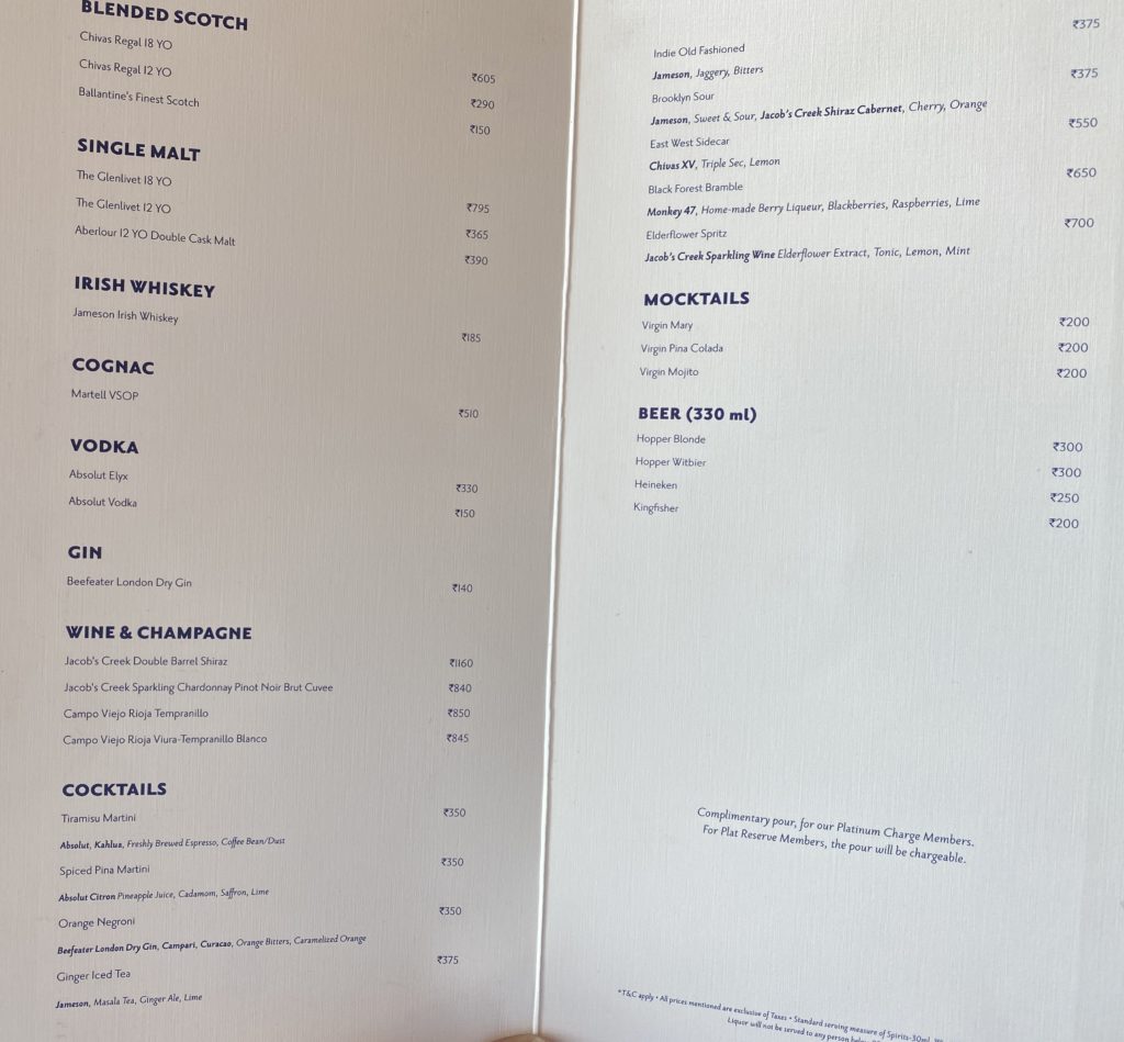 a menu with a drink in it