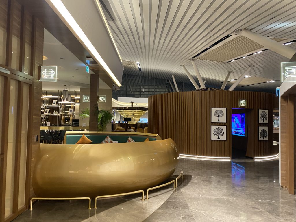 a lobby with a round gold object
