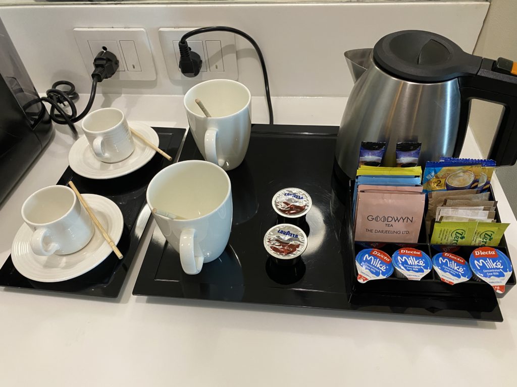 a tray with cups and saucers on it