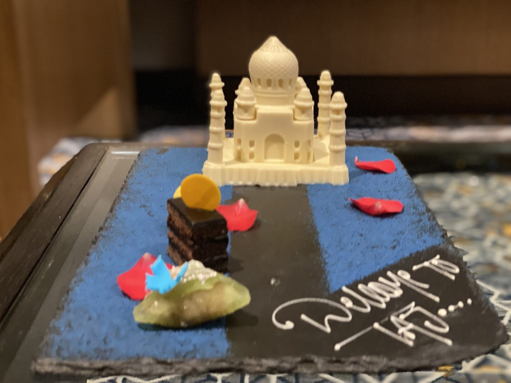 a cake with a castle and a cake on it