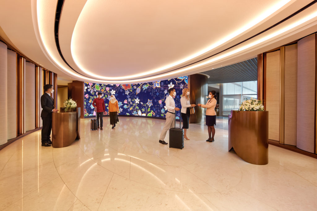 a group of people in a hotel lobby