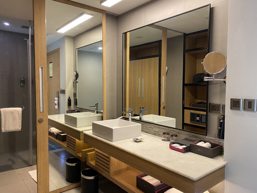 a bathroom with a large mirror and sinks