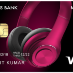 a credit card with pink headphones