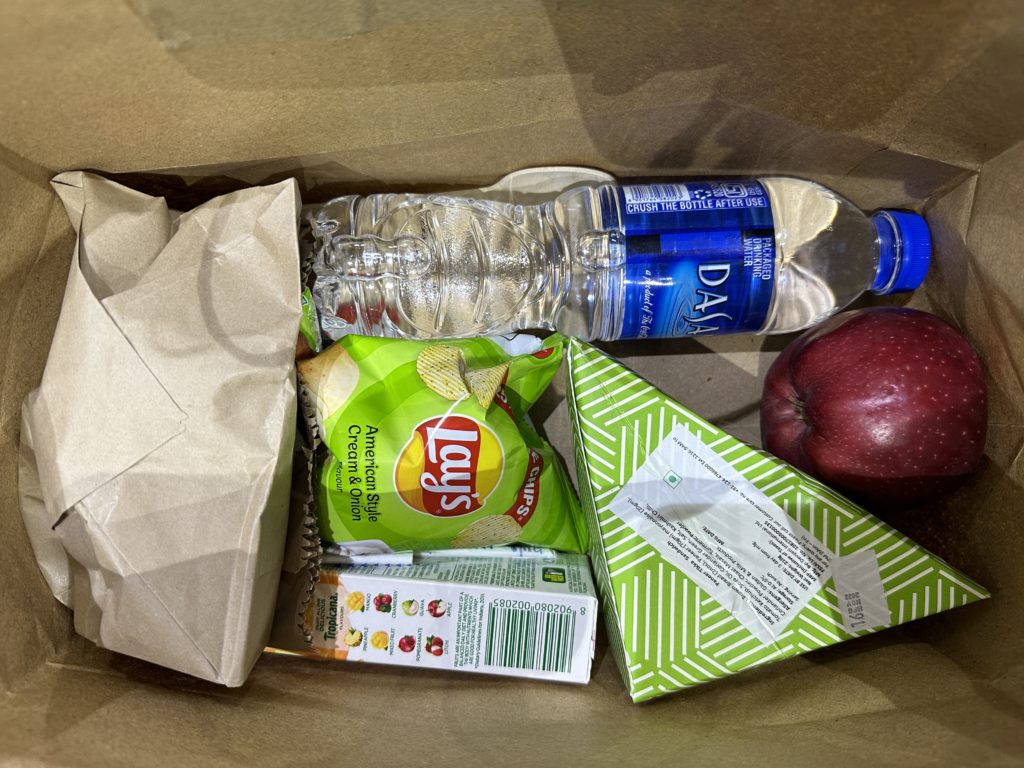 a bag of food and a water bottle