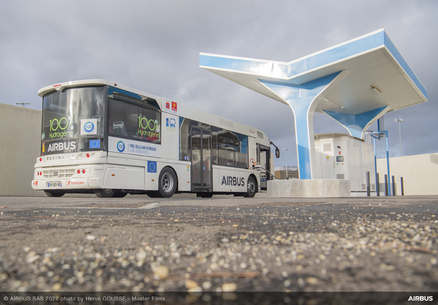 a bus parked at a gas station