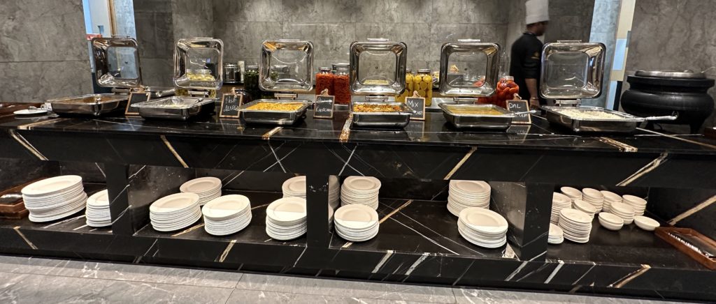 a buffet with plates and food on it
