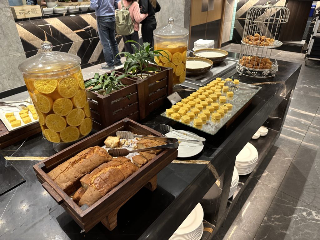 a buffet table with food and fruit