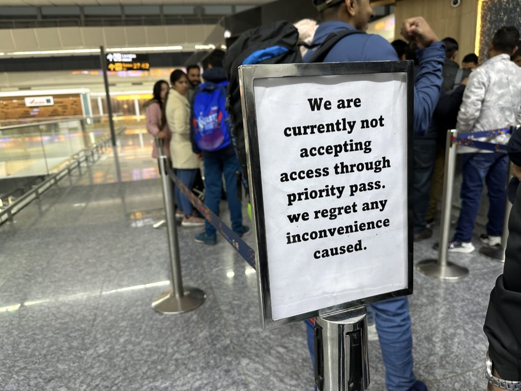 a sign in a line in a airport