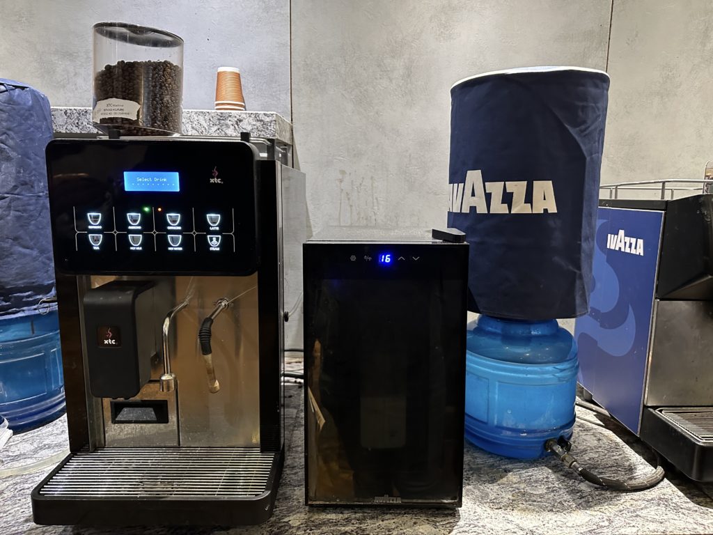 a coffee machine next to a container