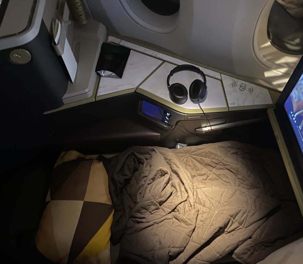 headphones on a bed in a plane