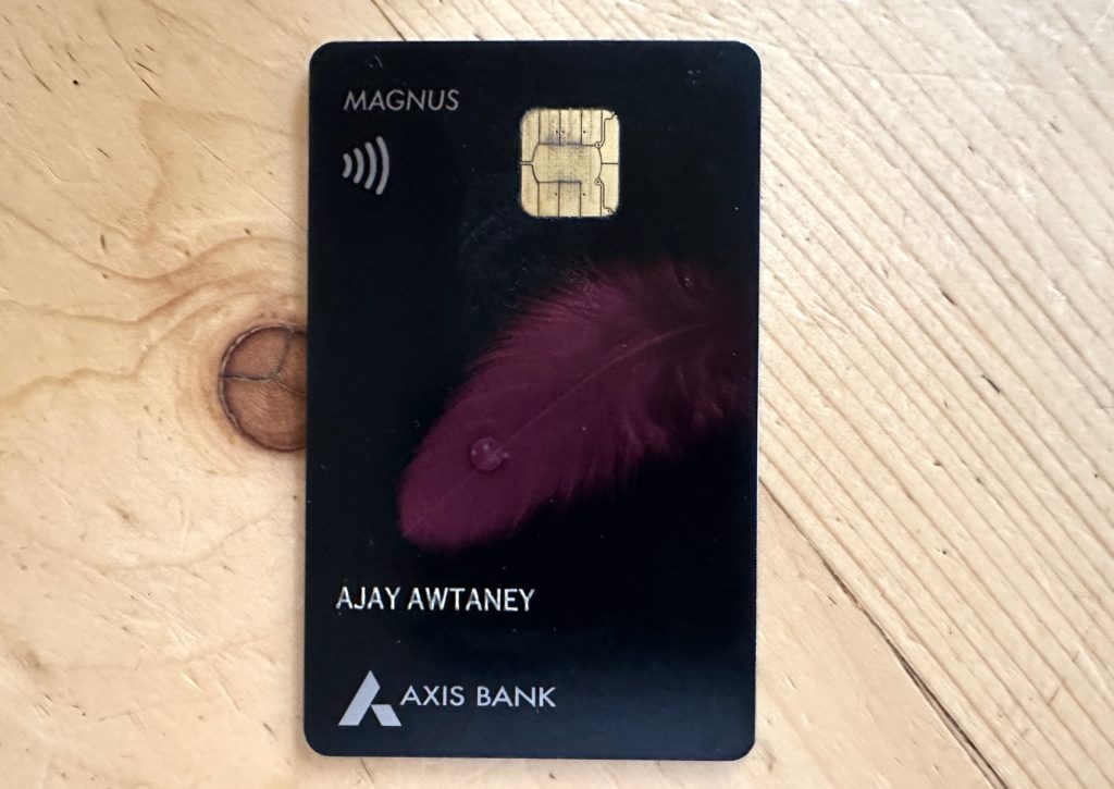 a credit card with a feather on it
