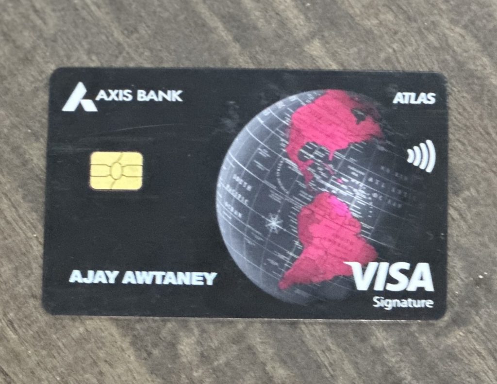 a credit card with a globe and a chip